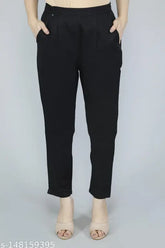 Cotton Women's Black Pant: 100% pure cotton pant with pleats detailing, side pockets, and elasticated back. Perfect for day or night outings, suitable for various occasions. Made in India